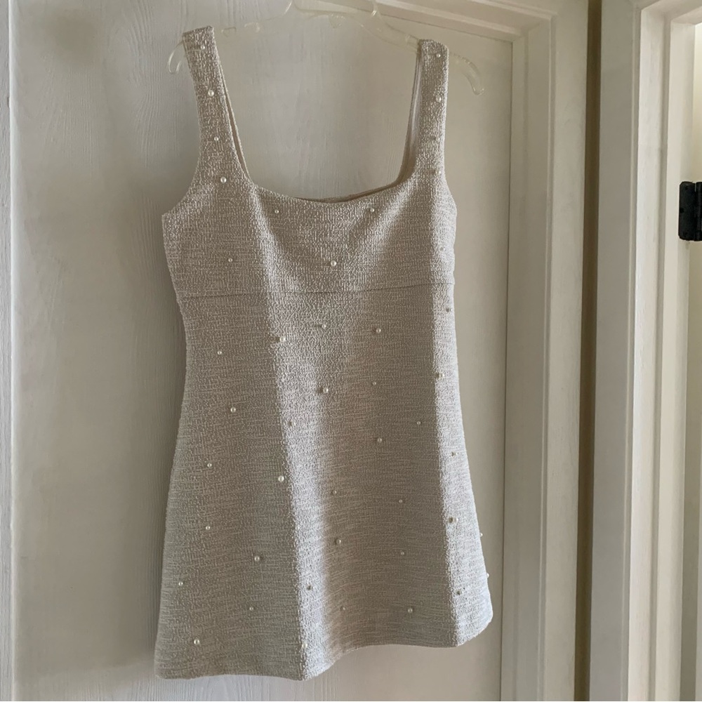 Elegant Cream Sleeveless Dress with Pearl Accents
